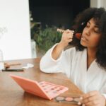 woman applying nail strengthener