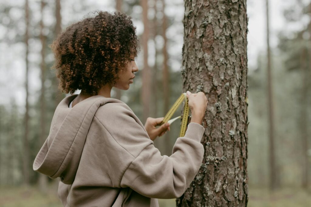 woman measuring herself for clothes