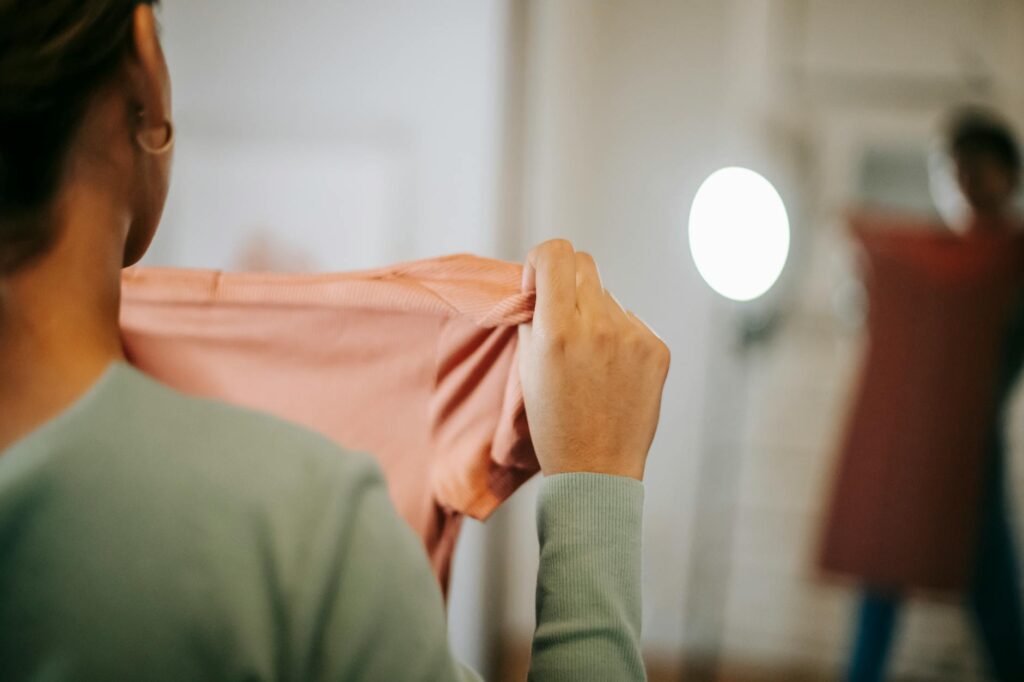 woman trying on casual dress